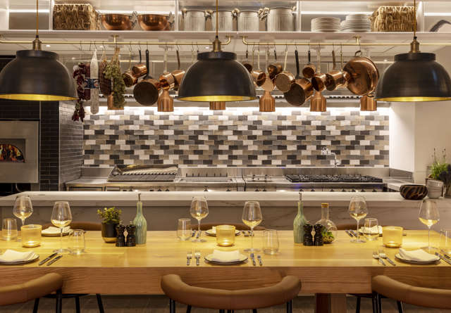 Commons Club kitchen inside Virgin Hotels Edinburgh with stylish decor, and a professional setup.