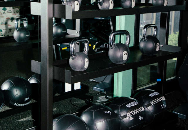 Rack of gym weights in a hotel gym at Virgin Hotels.