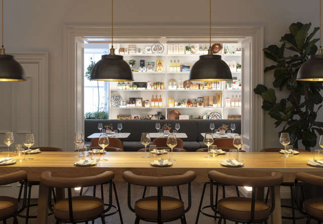 Sleek kitchen at Commons Club in Virgin Hotels Edinburgh with state-of-the-art appliances, stylish decor, and an open layout.